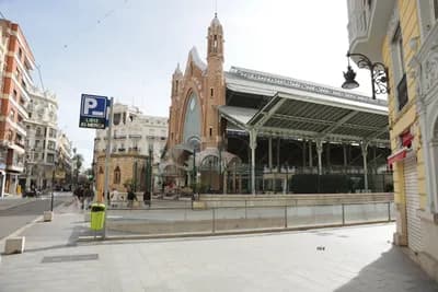 Historic market building with clock tower in Valencia, Spain.