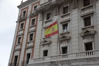 Spanish flag on a government building labeled 'Gobierno Militar'.