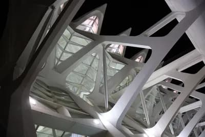 Close-up of modern architectural metal framework and glass panels.