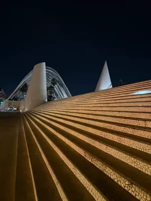 Modern architecture with illuminated steps at night.